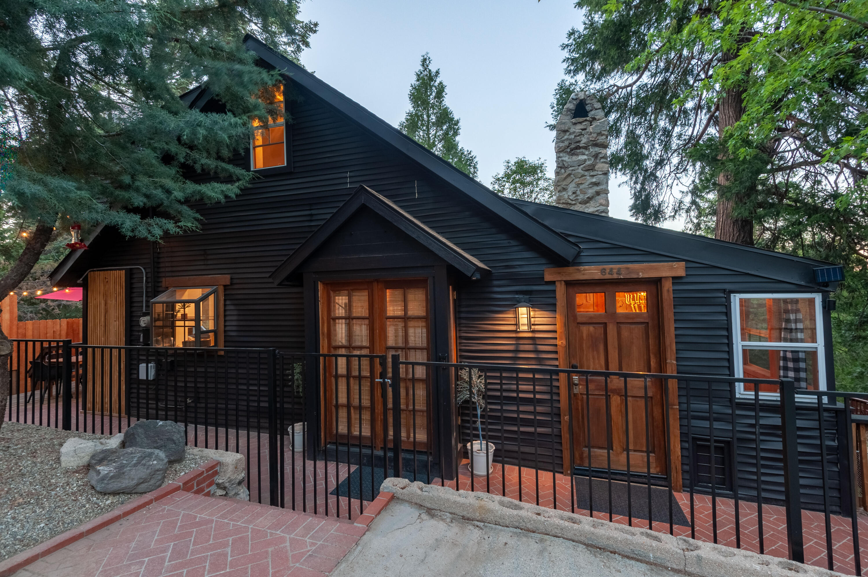 644 Cedar Lane Twin Peaks, CA 92391 - Photo 3 of 41 a front view of a house with a porch