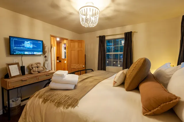 a bedroom with a bed and window