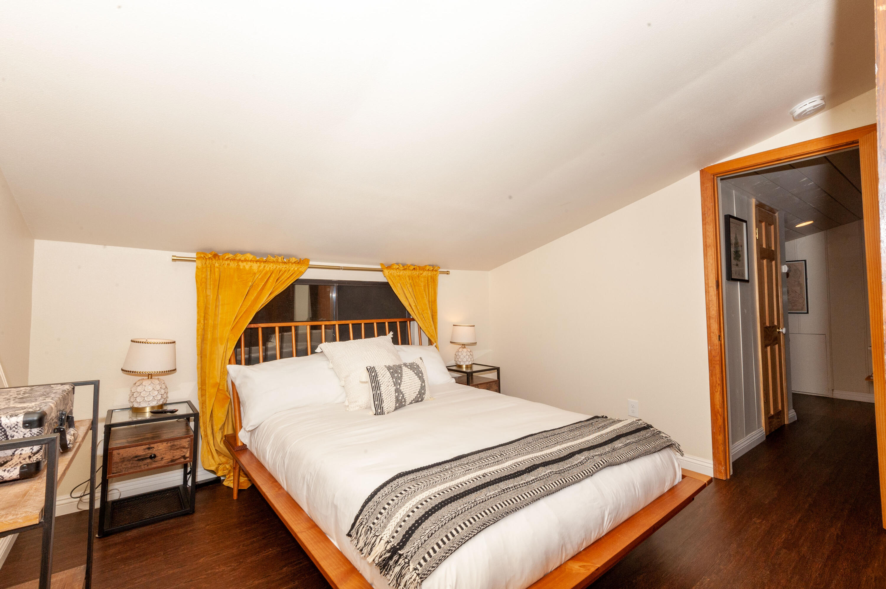 644 Cedar Lane Twin Peaks, CA 92391 - Photo 36 of 41 a bedroom with a bed and wooden floor