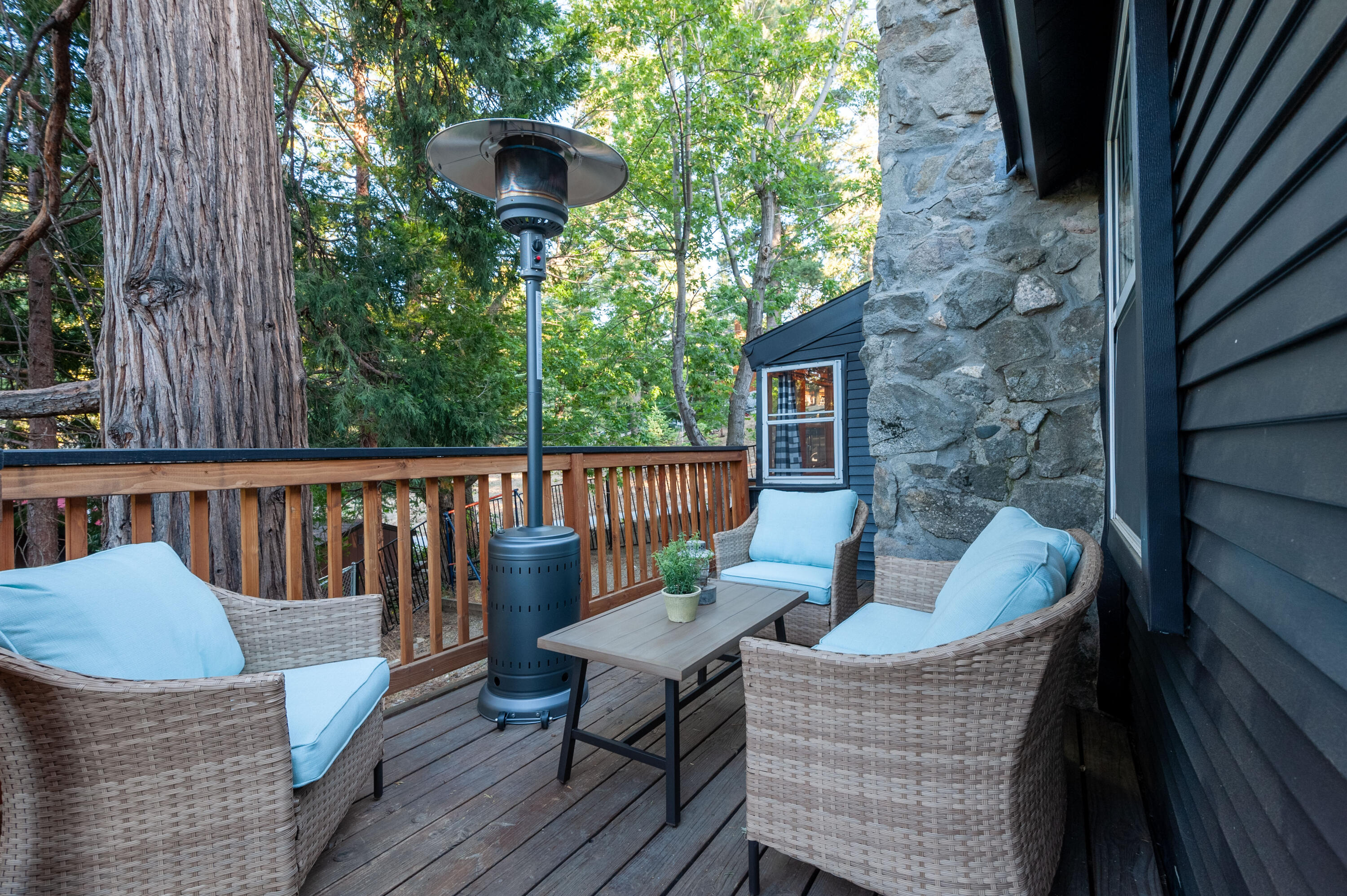 644 Cedar Lane Twin Peaks, CA 92391 - Photo 38 of 41 a balcony with wooden floor table and chairs