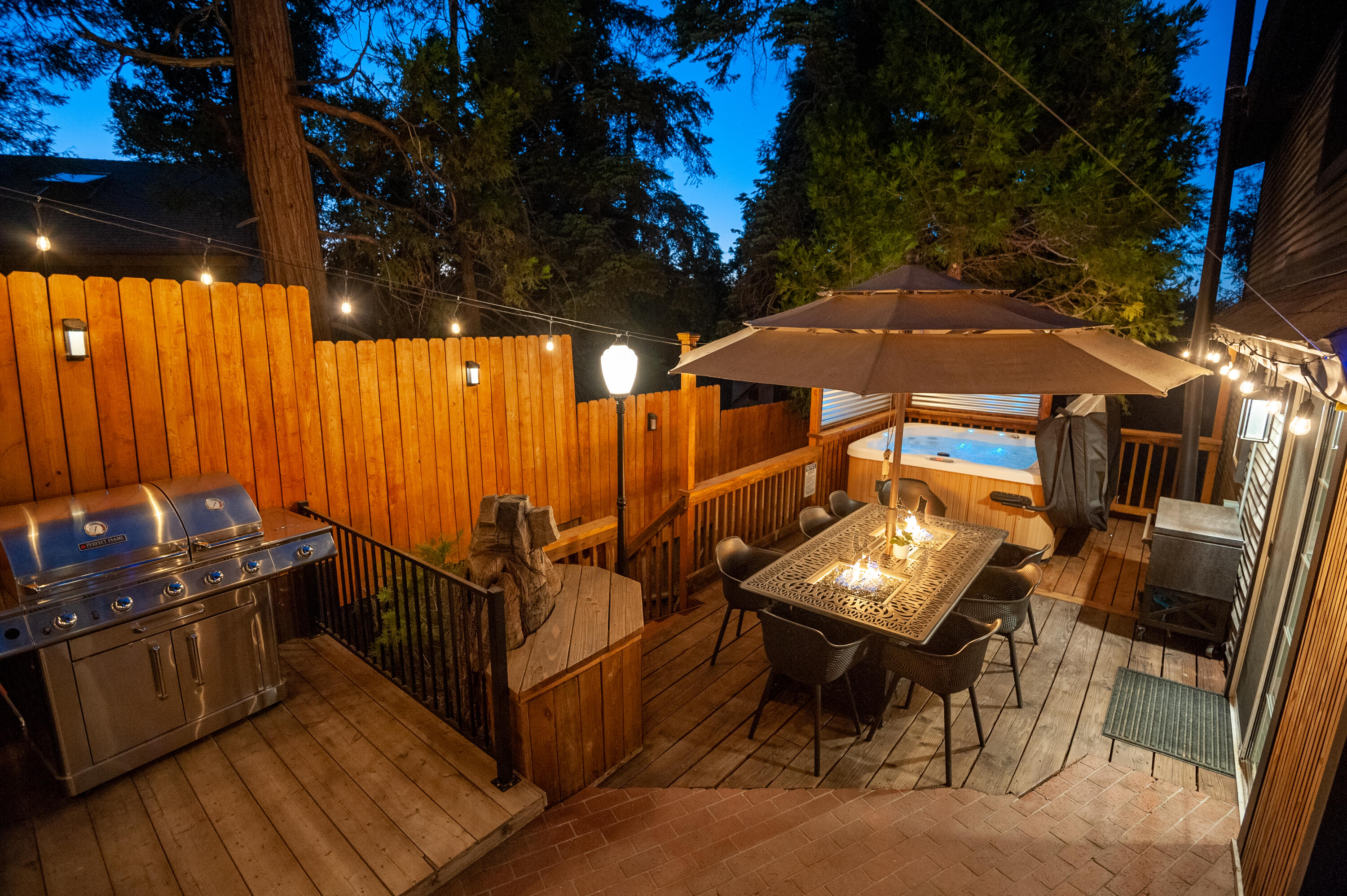 644 Cedar Lane Twin Peaks, CA 92391 - Photo 5 of 41 a view of a patio with table and chairs with wooden floor and fence