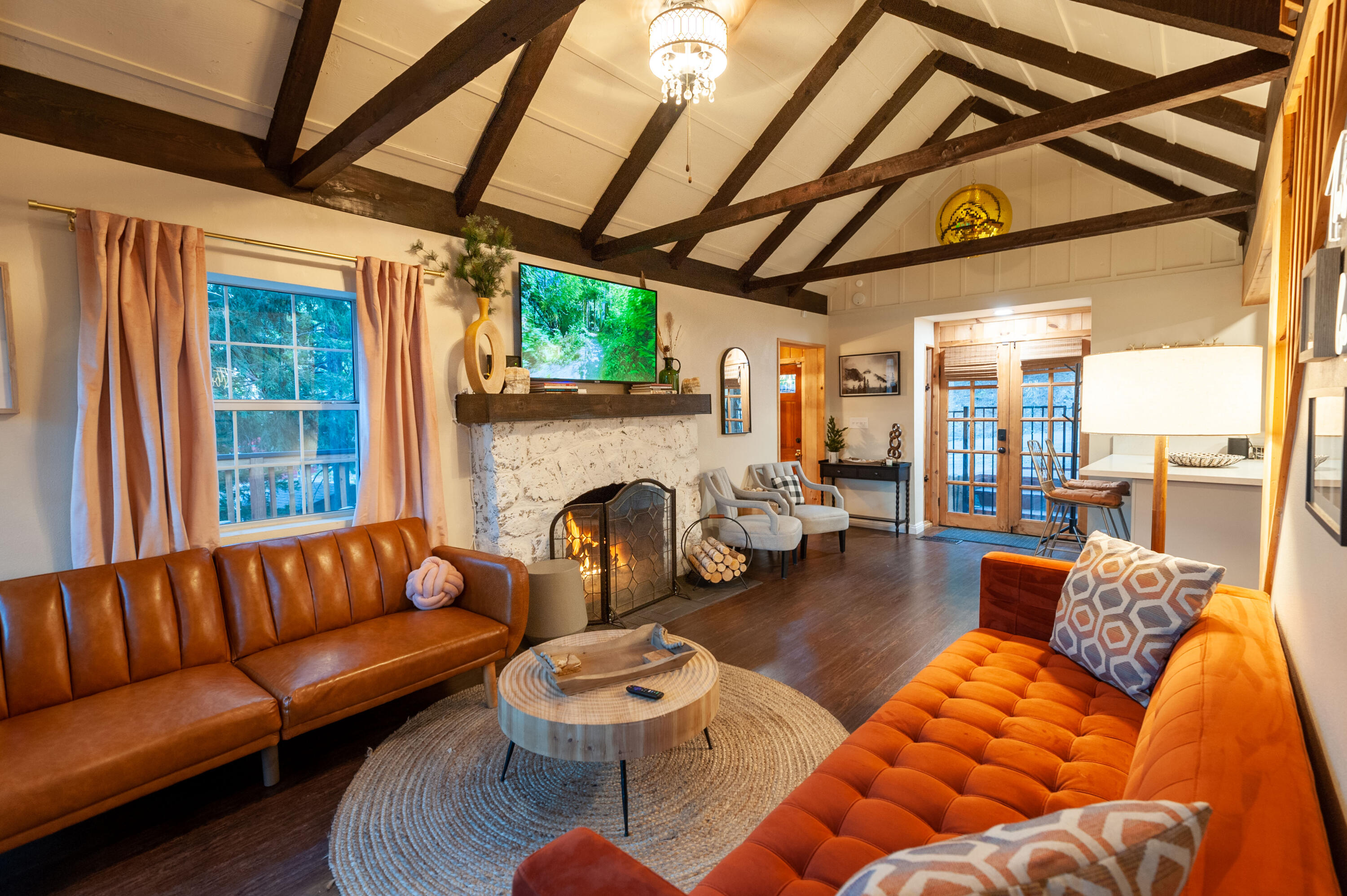 644 Cedar Lane Twin Peaks, CA 92391 - Photo 9 of 41 a living room with furniture a fireplace and a table