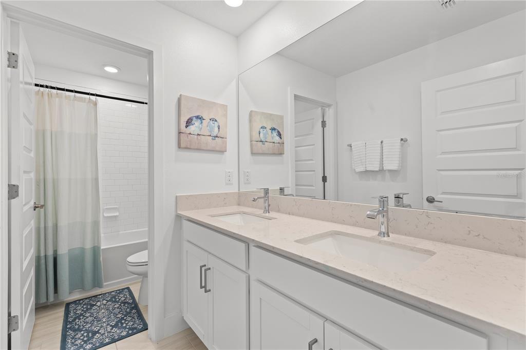 8280 Rolling Tides Drive New Port Richey, FL 34655 - Photo 28 of 49 a bathroom with a sink and a mirror