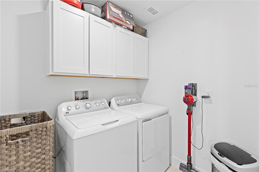 8280 Rolling Tides Drive New Port Richey, FL 34655 - Photo 33 of 49 a utility room with dryer and washer