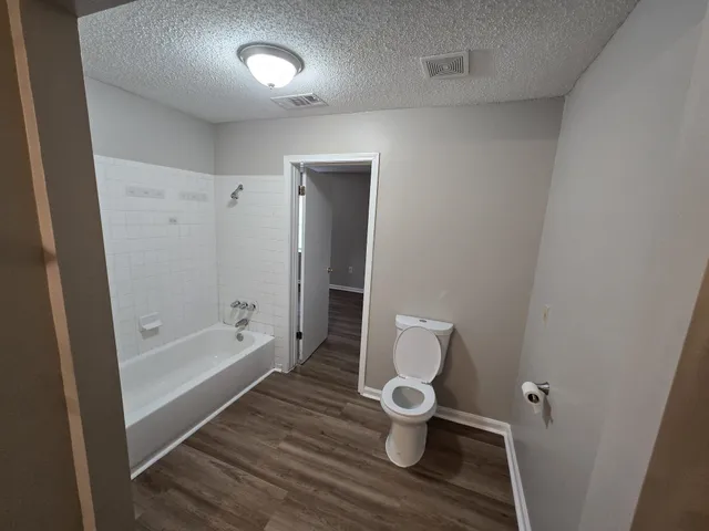 a bathroom with a sink a mirror and vanity