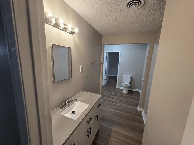 a kitchen with a refrigerator and a stove