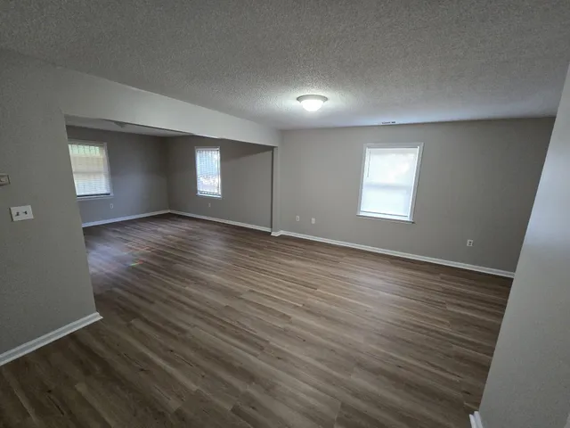 a view of entryway with wooden floor