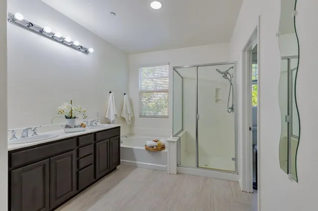 a bathroom with a double vanity sink and mirror