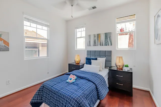 a bedroom with a bed and a window