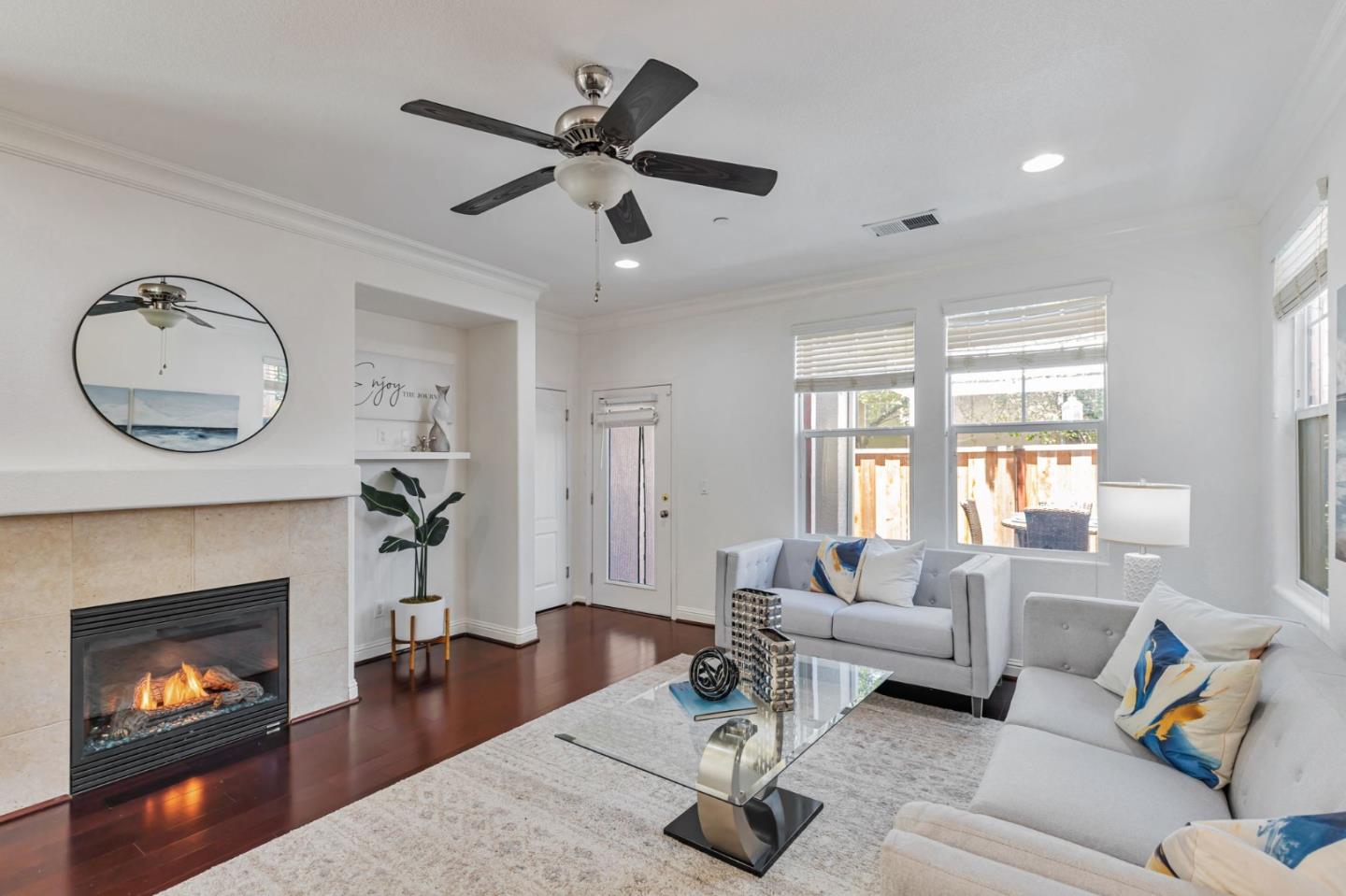 8940 Acorn Way Gilroy, CA 95020 - Photo 5 of 20 a living room with furniture a fireplace and a large window