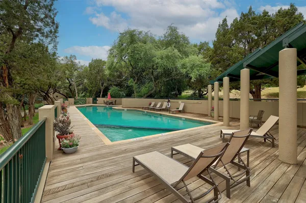 a view of a tennis court with sitting area