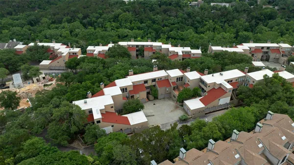 an aerial view of house with yard