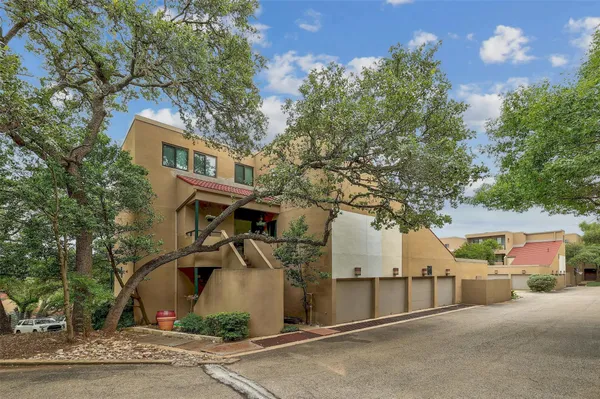 a view of a house with a tree