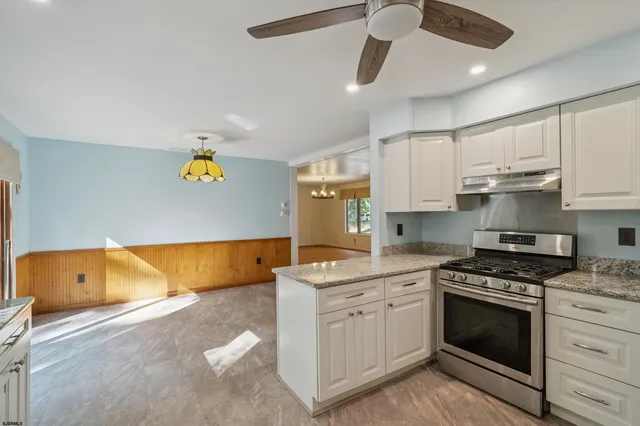 a kitchen with a sink and a bathtub