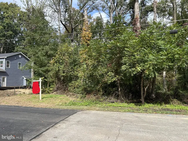a covered with trees in front of it