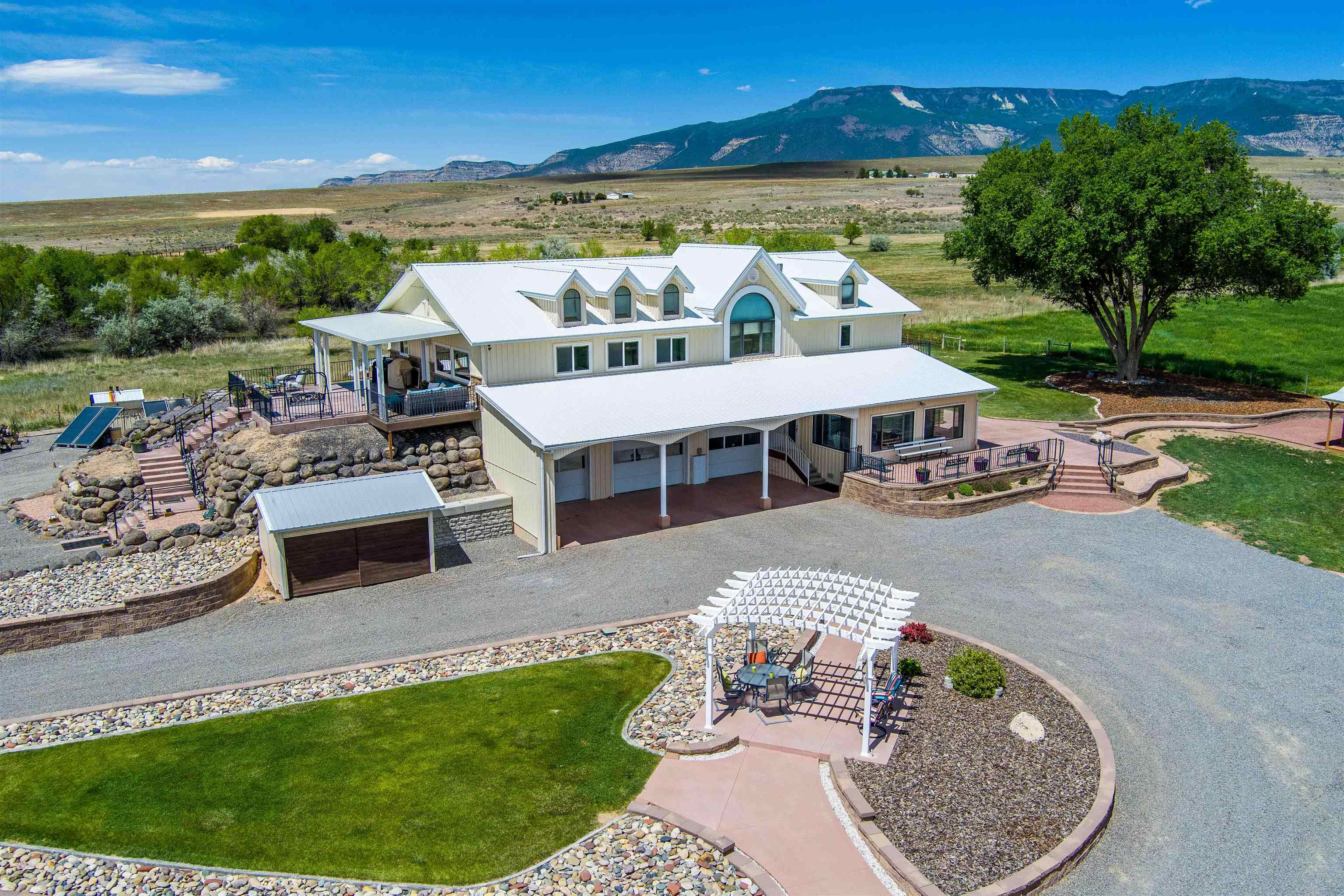 6800 Reeder Mesa Road Whitewater, CO 81527 - Photo 2 of 17 a terrace with outdoor seating and city view