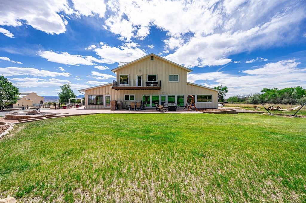 6800 Reeder Mesa Road Whitewater, CO 81527 - Photo 5 of 17 a aerial view of a house with a big yard and large trees
