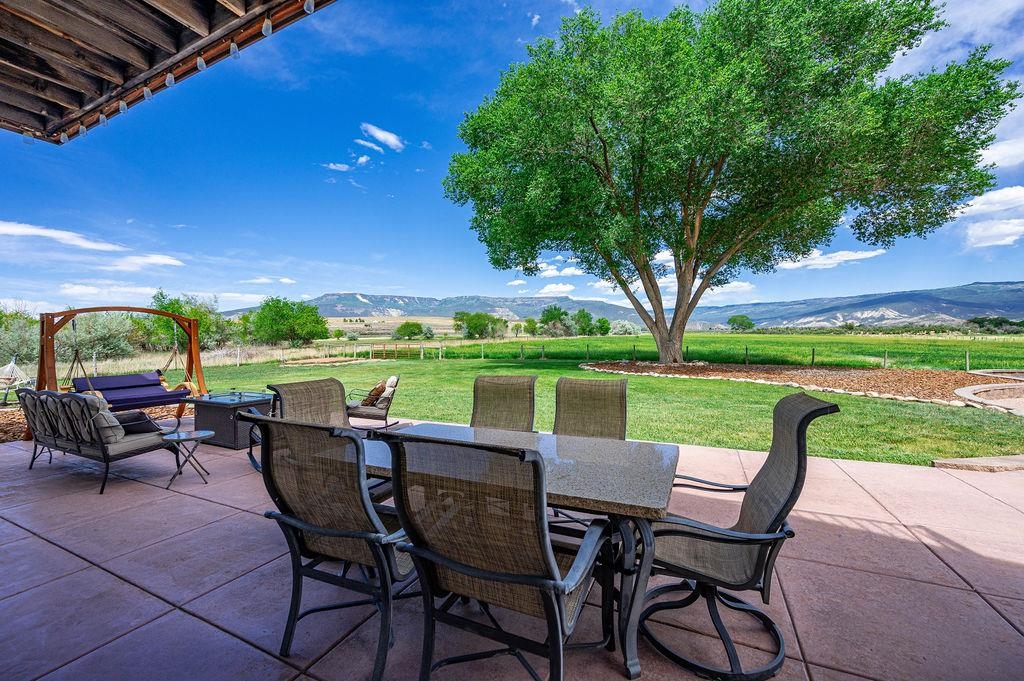 6800 Reeder Mesa Road Whitewater, CO 81527 - Photo 8 of 17 a view of a patio with chairs and a table
