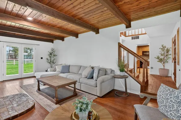 a living room with furniture and a table