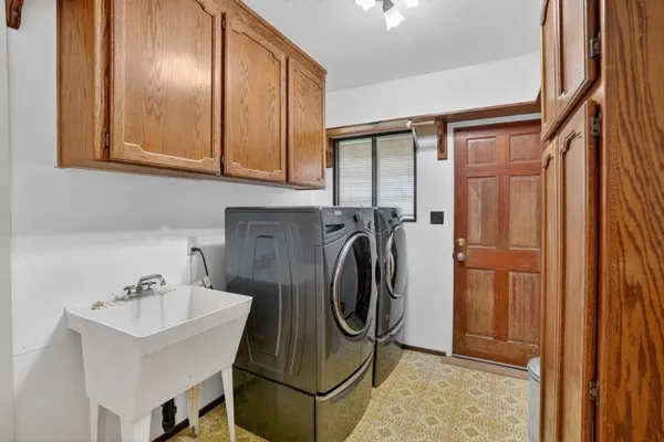 a utility room with dryer and washer