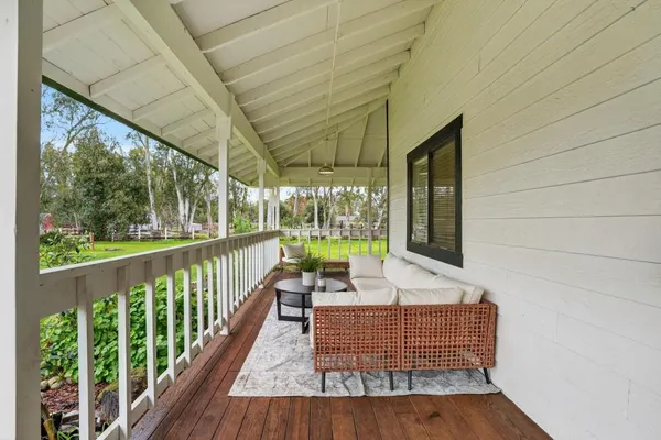 a view of balcony with wooden floor