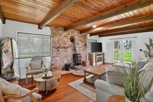 a living room with furniture windows and a fireplace
