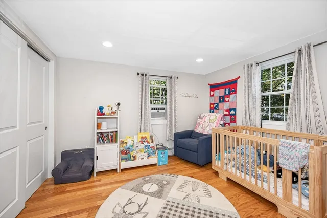 a bedroom with furniture and a window