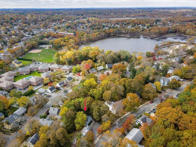 an aerial view of city and lake