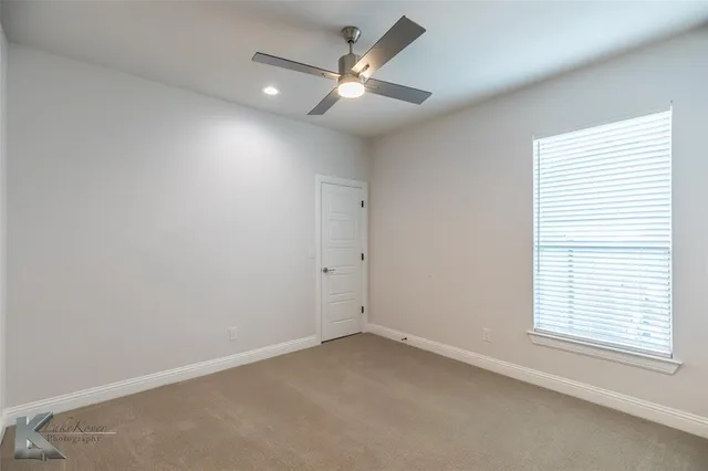 a bathroom with a granite countertop sink mirror and double