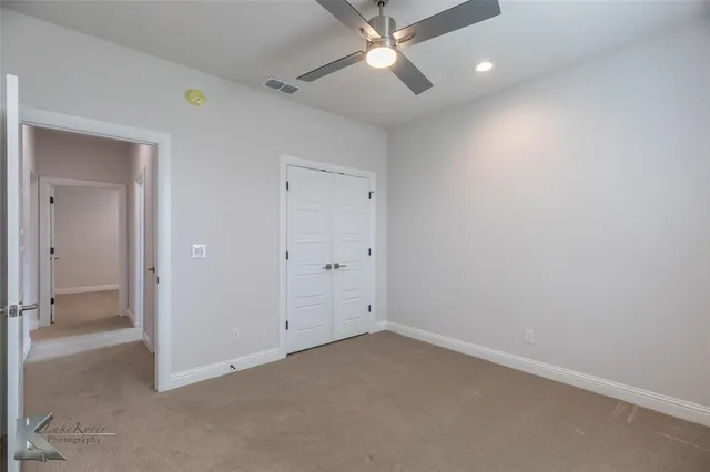 a bathroom with a granite countertop sink mirror and double