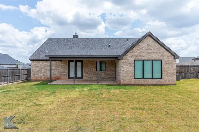 a view of a room with yard from a balcony