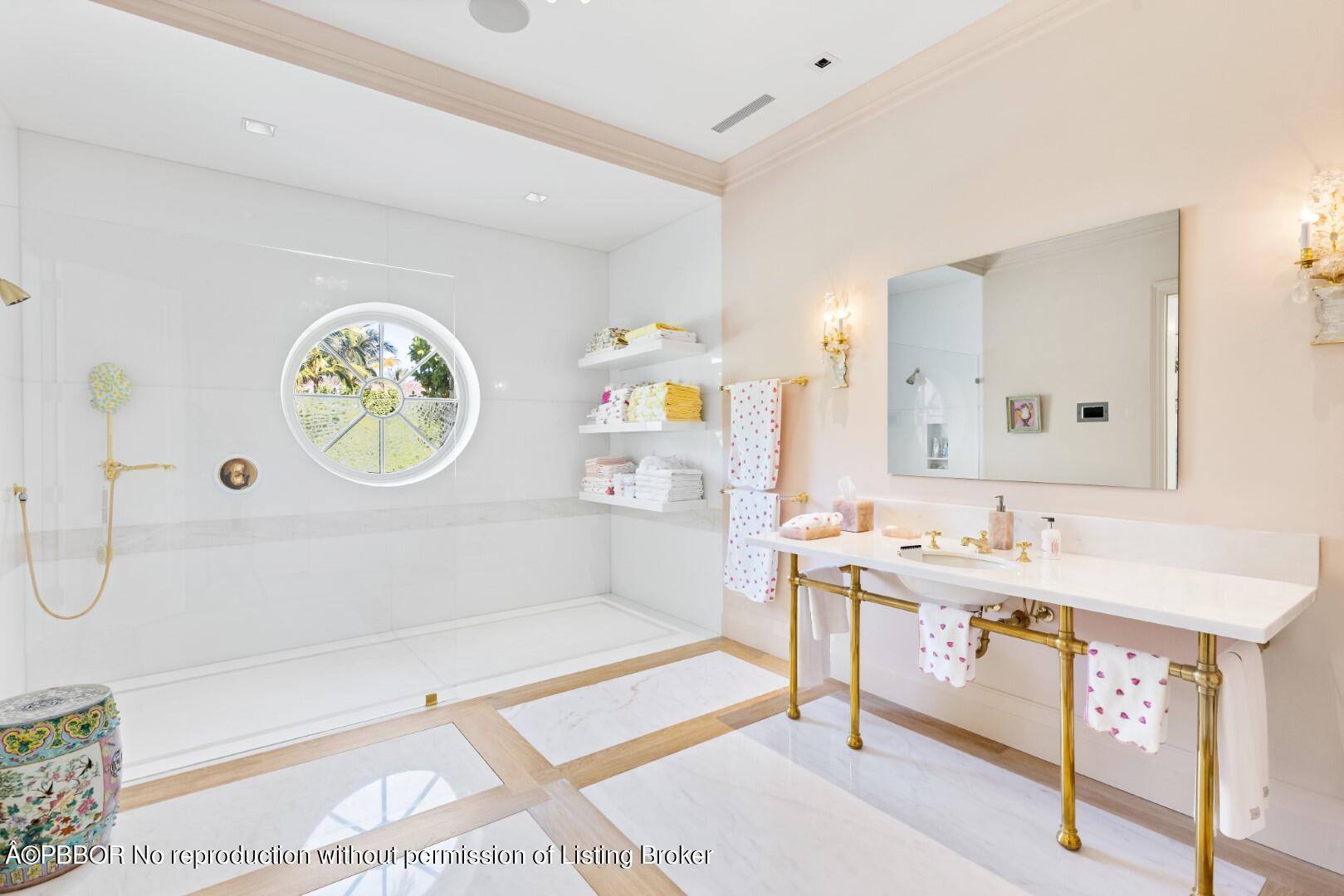 710 South County Road Palm Beach, FL 33480 - Photo 39 of 69 a bathroom with a sink a vanity and a mirror