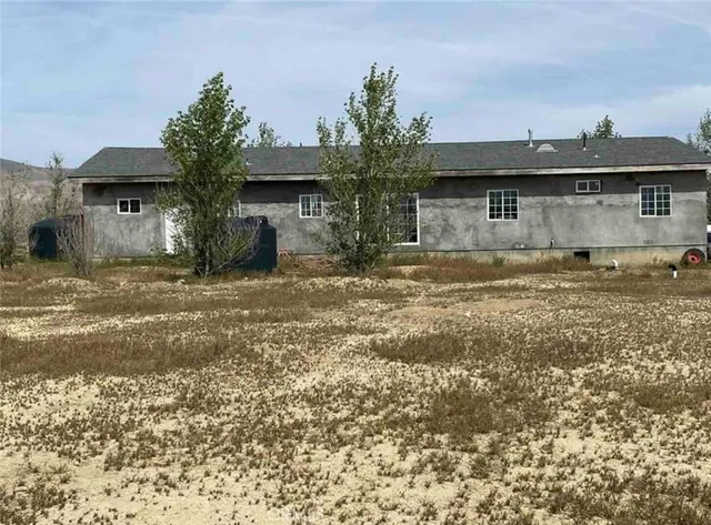 a view of large house with a snow on the beach