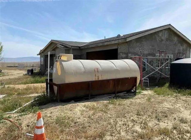 a view of a hallway with living room and furniture