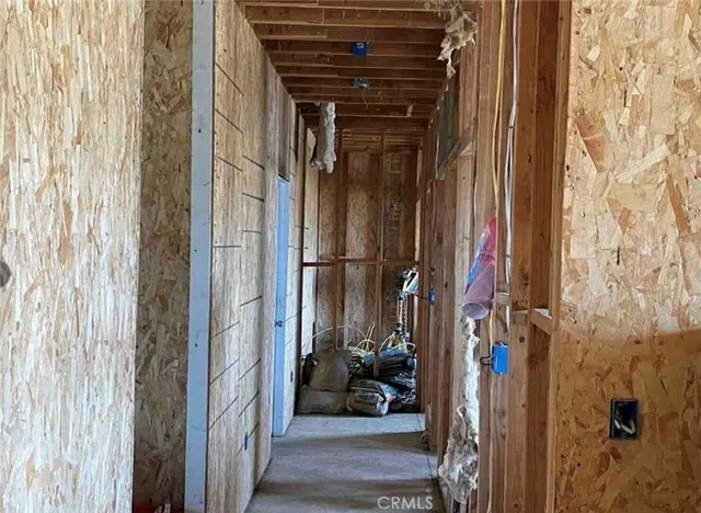 a view of a patio with a table and chairs