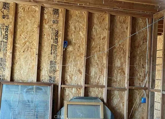 a view of backyard with plants and outdoor seating
