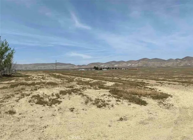 a view of a house with snow in the yard