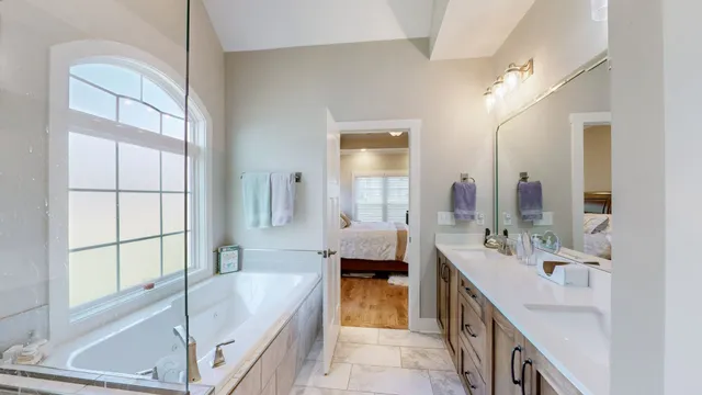 a bathroom with a glass shower door