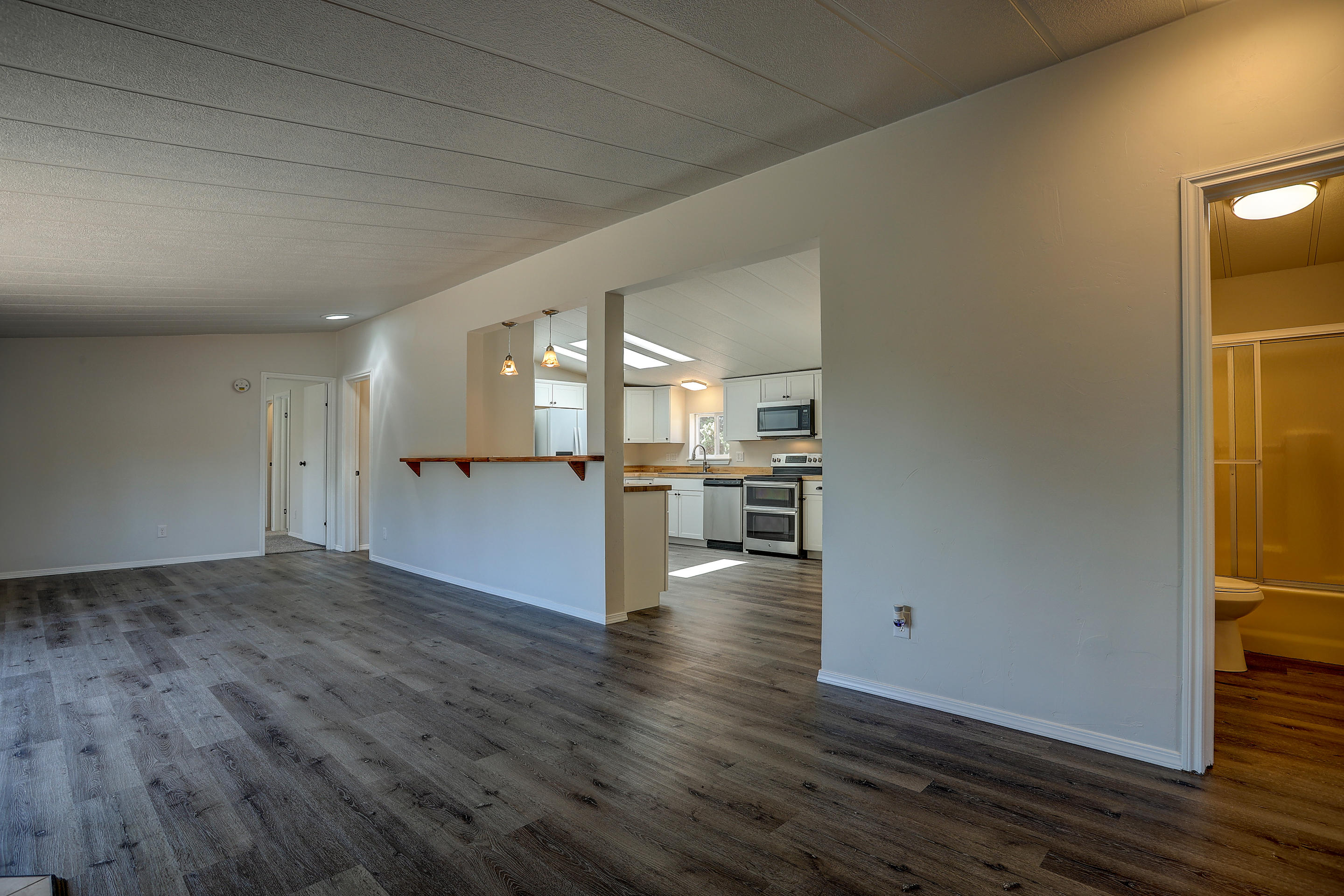 8085 Southwest Crater Loop Road Terrebonne, OR 97760 - Photo 11 of 26 living to kitchen other angle