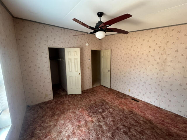 10978 Oak Run Road Oak Run, CA 96069 - Photo 11 of 17 a view of a livingroom with a ceiling fan and window