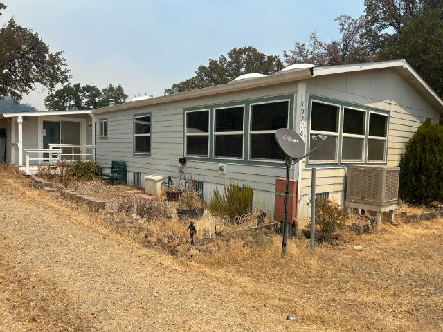10978 Oak Run Road Oak Run, CA 96069 - Photo 17 of 17 a front view of house with yard outdoor seating and barbeque oven