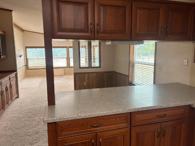 10978 Oak Run Road Oak Run, CA 96069 - Photo 8 of 17 a kitchen with granite countertop a coffee maker on granite counter tops and a view of living room