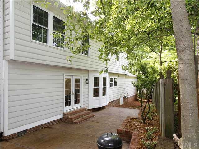 4301 Hickory Ridge Drive Raleigh, NC 27609 - Photo 21 of 25 This shady back patio will be the perfect setting for summer barbecues. Back Yard