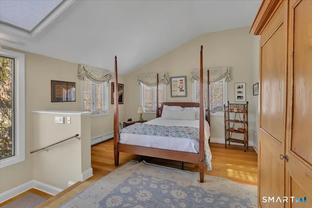 a bathroom with a granite countertop double vanity sink and a mirror