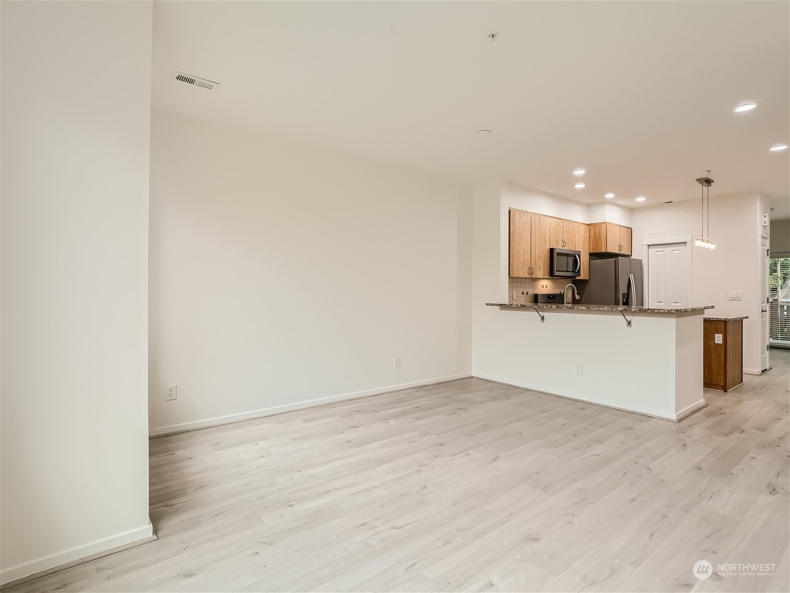 101 Sky Ridge Road Northwest, Unit 502 Issaquah, WA 98027 - Photo 17 of 31 a view of kitchen with wooden floor