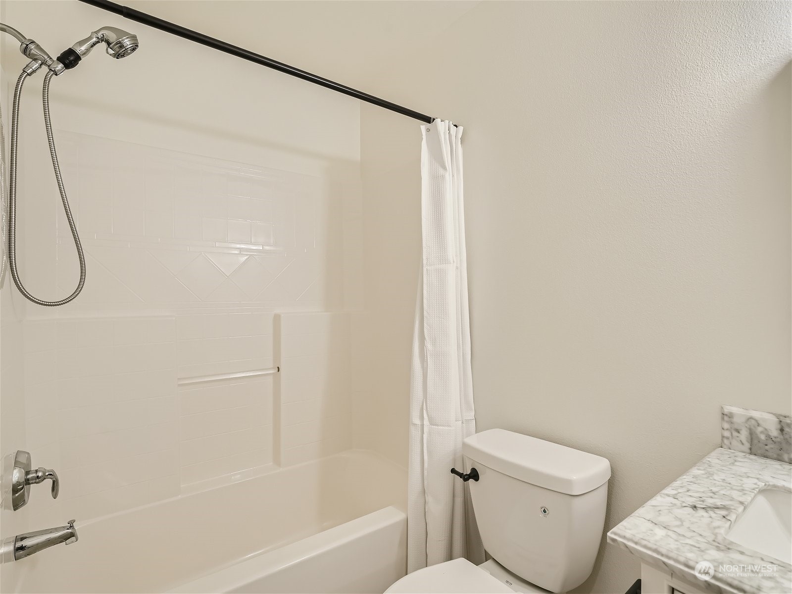 101 Sky Ridge Road Northwest, Unit 502 Issaquah, WA 98027 - Photo 28 of 31 a bathroom with a shower a toilet and a shower
