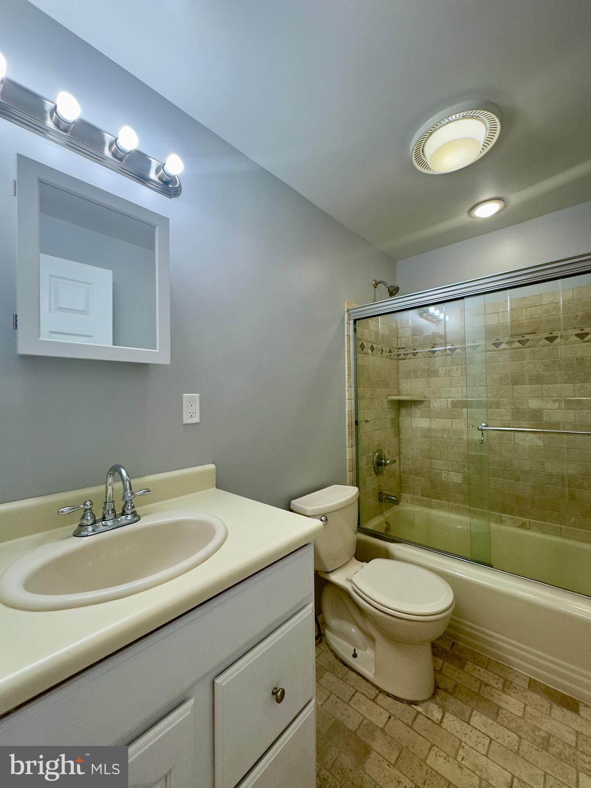7716 Wynbrook Road Baltimore, MD 21224 - Photo 12 of 15 a bathroom with a sink toilet and shower