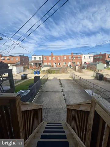 a view of a swimming pool and a yard