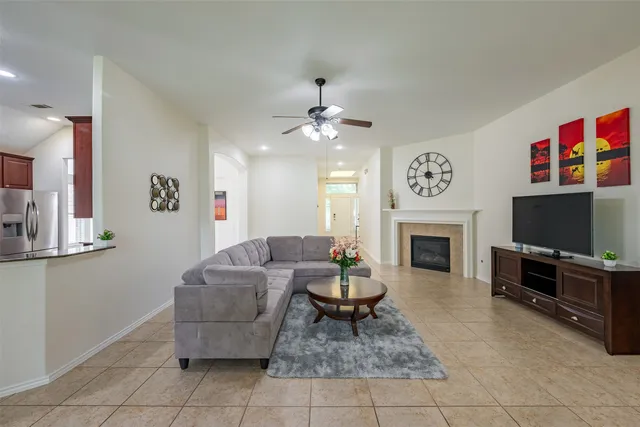 a living room with furniture and a fireplace