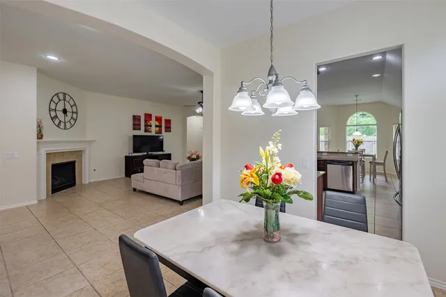 a bedroom with a bed and a flat tv screen on the dresser
